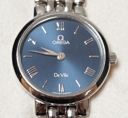A lady's 1990's stainless steel Omega De Ville quartz wrist watch, with blue dial, box and papers.